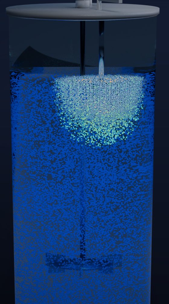 The simulated vessel at full height with a cloud of cells and bubbles below the feed.